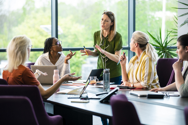 Employees talking in an eco friendly workplace