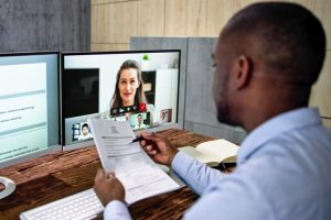 An employer is conducting a video conference as part of the hiring process to screen an applicant.