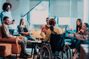A diverse group of workers is having a brainstorming session, representing how staffing agencies support a company’s inclusive hiring goals.