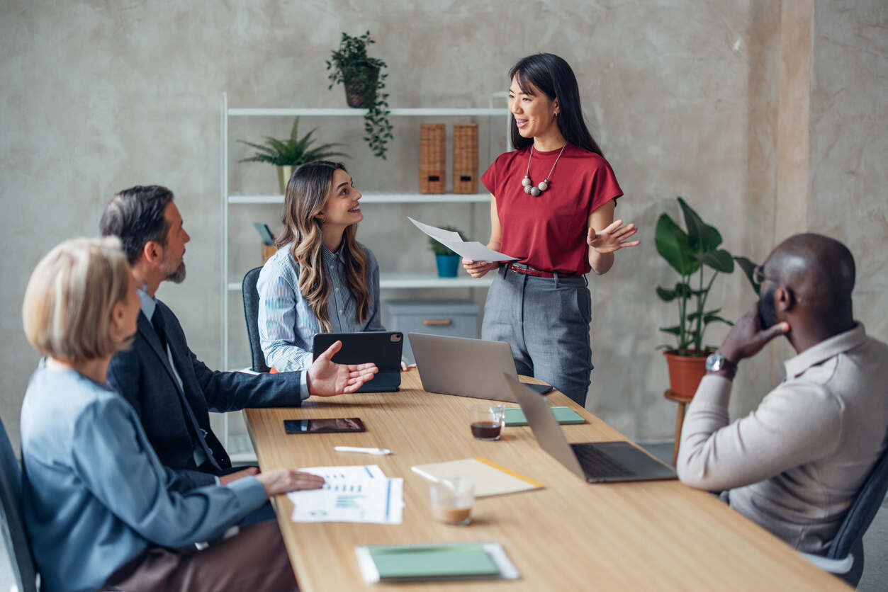 Employee leasing vs temporary staffing team meeting with business professionals discussing workforce strategy and hiring solutions in a modern office setting.
