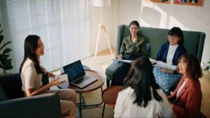 Business team meeting discussing workplace culture and employee retention, illustrating staff turnover meaning and its impact on collaboration, communication, and long-term workforce stability.